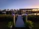 Private dock with lights at sunset at 4430 Wynkoop Cir, Port Charlotte, FL 33948