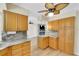 Kitchen with granite countertops, wood cabinets, and breakfast bar at 4430 Wynkoop Cir, Port Charlotte, FL 33948