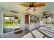 Covered lanai with ceiling fans and access to the pool area at 4430 Wynkoop Cir, Port Charlotte, FL 33948