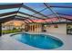 Lovely kidney shaped pool and screened enclosure at 4430 Wynkoop Cir, Port Charlotte, FL 33948
