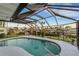 Relaxing kidney-shaped pool with screened enclosure at 4430 Wynkoop Cir, Port Charlotte, FL 33948