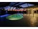 Relaxing kidney-shaped pool with patio at dusk at 4430 Wynkoop Cir, Port Charlotte, FL 33948