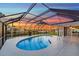 Relaxing kidney-shaped pool, screened enclosure, sunset views at 4430 Wynkoop Cir, Port Charlotte, FL 33948