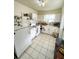 Efficient kitchen with white appliances and ample counter space at 4444 Los Rios St, North Port, FL 34287