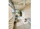 Bright, screened porch with tiled floor and access to the backyard at 4444 Los Rios St, North Port, FL 34287