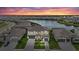 Aerial view of house and neighborhood, highlighting water feature at 4886 Seafoam Trl, Bradenton, FL 34211