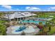 Community pool with water features and expansive deck at 4886 Seafoam Trl, Bradenton, FL 34211