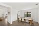 Bright dining room with hardwood floors and a view to the kitchen at 4886 Seafoam Trl, Bradenton, FL 34211