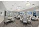 Spacious dining area with plenty of seating, modern lighting, and large windows for natural light at 4886 Seafoam Trl, Bradenton, FL 34211