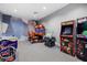 Game Room with arcade games and racing simulators at 4886 Seafoam Trl, Bradenton, FL 34211
