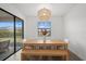 Bright dining room with light wood table and bench seating at 4886 Seafoam Trl, Bradenton, FL 34211