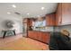 Kitchen with stainless steel appliances and wood cabinets at 523 N Spoonbill Dr, Sarasota, FL 34236