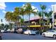 St. Armands Circle street scene with palm trees, shops, and parked cars at 523 N Spoonbill Dr, Sarasota, FL 34236