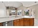 Kitchen with island, sink, and view of pool at 5383 Creekside Trl, Sarasota, FL 34243