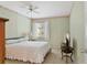 Bright bedroom with a double bed, and a side table at 5889 Canal Dr # I4, Bradenton, FL 34207
