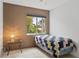 Small bedroom with a twin bed and a side table at 5889 Canal Dr # I4, Bradenton, FL 34207