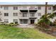 Two-story building with private balconies and ground-floor patios at 5889 Canal Dr # I4, Bradenton, FL 34207