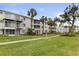 Expansive green lawn with mature trees and walkways at 5889 Canal Dr # I4, Bradenton, FL 34207