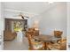 Bright dining area with table and chairs, open to living room at 5889 Canal Dr # I4, Bradenton, FL 34207