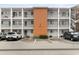 Two-story building exterior with parking and landscaping at 5889 Canal Dr # I4, Bradenton, FL 34207