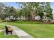 Landscaped grounds with a walking path and benches at 5889 Canal Dr # I4, Bradenton, FL 34207