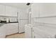 White kitchen with appliances and washer and dryer at 5889 Canal Dr # I4, Bradenton, FL 34207