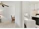 Kitchen with white cabinets and view of dining area at 5889 Canal Dr # I4, Bradenton, FL 34207