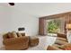 Living room with sofa, loveseat and sliding glass doors at 5889 Canal Dr # I4, Bradenton, FL 34207