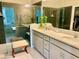 Modern bathroom with double vanity, large shower, and glass enclosure at 6014 Fiore Dr, Bradenton, FL 34208