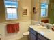 Clean bathroom with a single vanity, toilet, and updated finishes at 6014 Fiore Dr, Bradenton, FL 34208