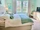 King-size bed in a tranquil bedroom with light and airy feel at 6014 Fiore Dr, Bradenton, FL 34208
