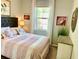 Charming bedroom with a queen-size bed and coastal-inspired decor at 6014 Fiore Dr, Bradenton, FL 34208