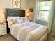 Charming bedroom with a queen-size bed and coastal-inspired decor at 6014 Fiore Dr, Bradenton, FL 34208