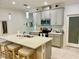 Modern kitchen with a large island and stainless steel appliances at 6014 Fiore Dr, Bradenton, FL 34208