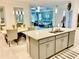 Spacious kitchen features an island with seating and opens to dining area at 6014 Fiore Dr, Bradenton, FL 34208