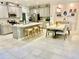 Open floor plan showcasing kitchen island and dining area at 6014 Fiore Dr, Bradenton, FL 34208