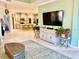 Bright living room with an open concept view of the kitchen at 6014 Fiore Dr, Bradenton, FL 34208