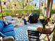 Relaxing screened patio with comfortable seating and grill at 6014 Fiore Dr, Bradenton, FL 34208