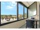 Private balcony with water views and outdoor seating at 6267 Midnight Pass Rd # 307, Sarasota, FL 34242