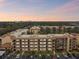 Aerial view of condo building with parking and landscaping at 635 30Th Ave W # F206, Bradenton, FL 34205