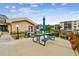 Community picnic area with grill and tables under an umbrella at 635 30Th Ave W # F206, Bradenton, FL 34205