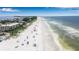 Aerial view of beach with people and ocean at 635 30Th Ave W # F206, Bradenton, FL 34205