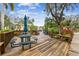 Community deck with multiple tables and umbrellas for outdoor dining at 635 30Th Ave W # F206, Bradenton, FL 34205