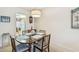 Condo dining room with table and chairs at 635 30Th Ave W # F206, Bradenton, FL 34205