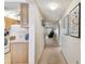 Hallway view of condo with kitchen and living room at 635 30Th Ave W # F206, Bradenton, FL 34205