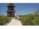 Couple walking nature trail near observation tower at 635 30Th Ave W # F206, Bradenton, FL 34205