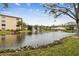Community pond with landscaping and fountain at 635 30Th Ave W # F206, Bradenton, FL 34205