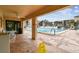 Community pool area with lounge chairs and covered patio at 635 30Th Ave W # F206, Bradenton, FL 34205