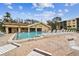 Inviting community pool with surrounding deck and lounge chairs at 635 30Th Ave W # F206, Bradenton, FL 34205
