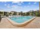 Refreshing community swimming pool with plenty of lounge chairs at 635 30Th Ave W # F206, Bradenton, FL 34205